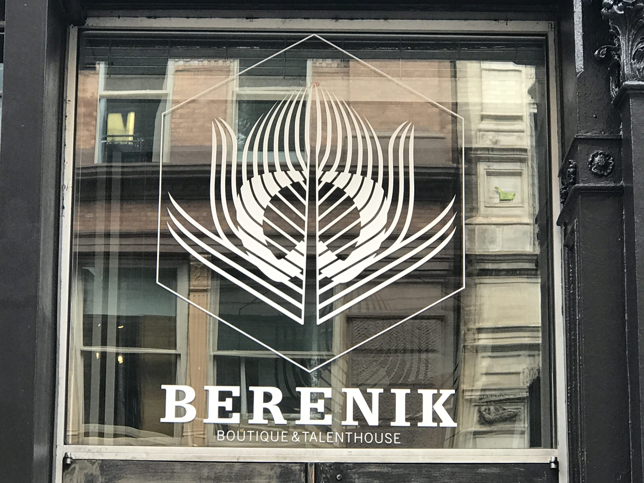 A cut to shape vinyl window decal logo for Berenik - a talenthouse storefront