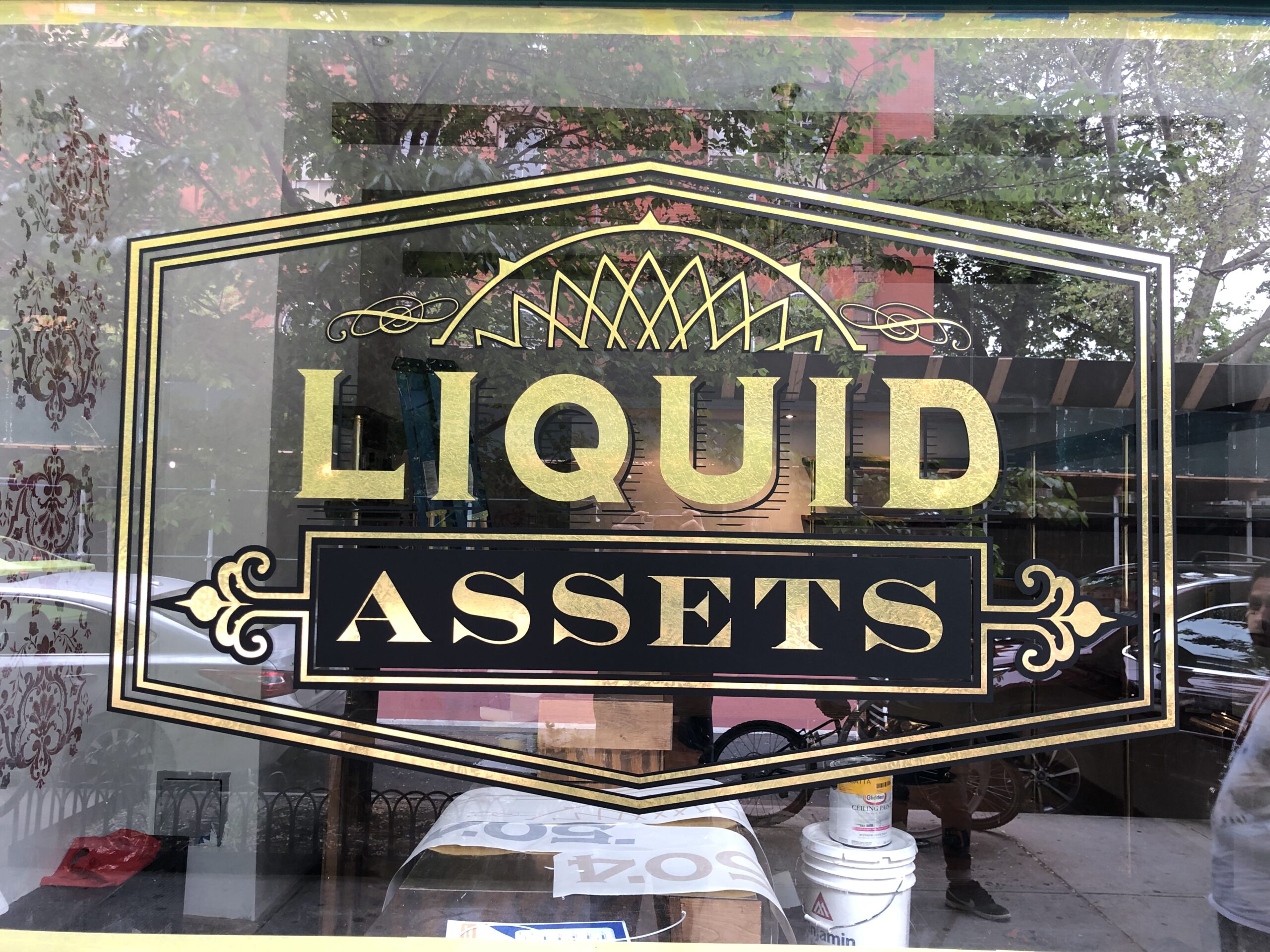 A storefront window decal in specialized gold leaf finish film for new york city businesses.